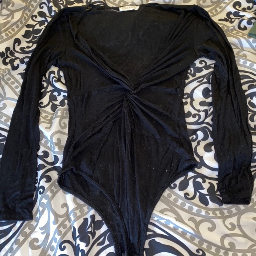 Twisted black body suit